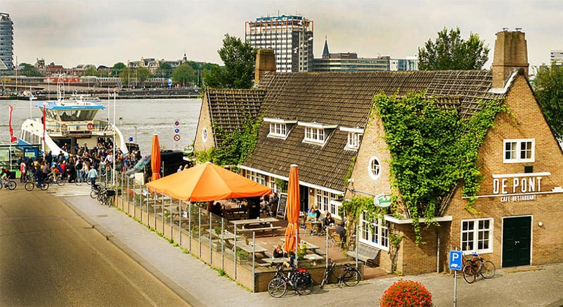 At Cafe De Pont, the large old ferry building is now a wonderful cafe-restaurant with a sunny terrace. Have a drink, a snack or a whole meal. It's just steps from the free ferry from Amsterdam Central Station. 