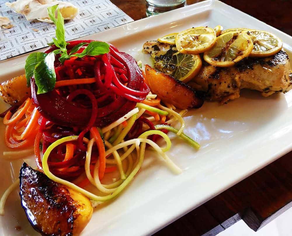 Lemon Chicken and a salad of julienned beets, zucchini, carrots and spinach with grilled peaches at Nonna Cucina in Mexico City