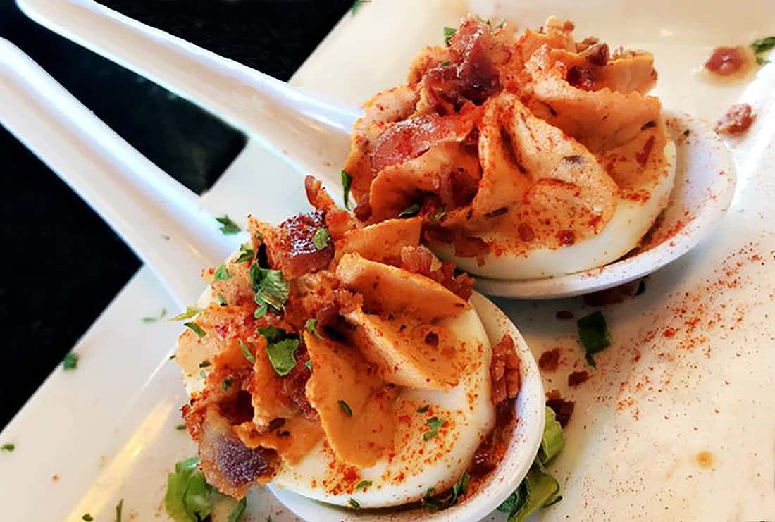 Beautiful chipotle deviled eggs, served in Japanese soup spoons, are a specialty at The Haunted Hamburger, in Jerome, Arizona