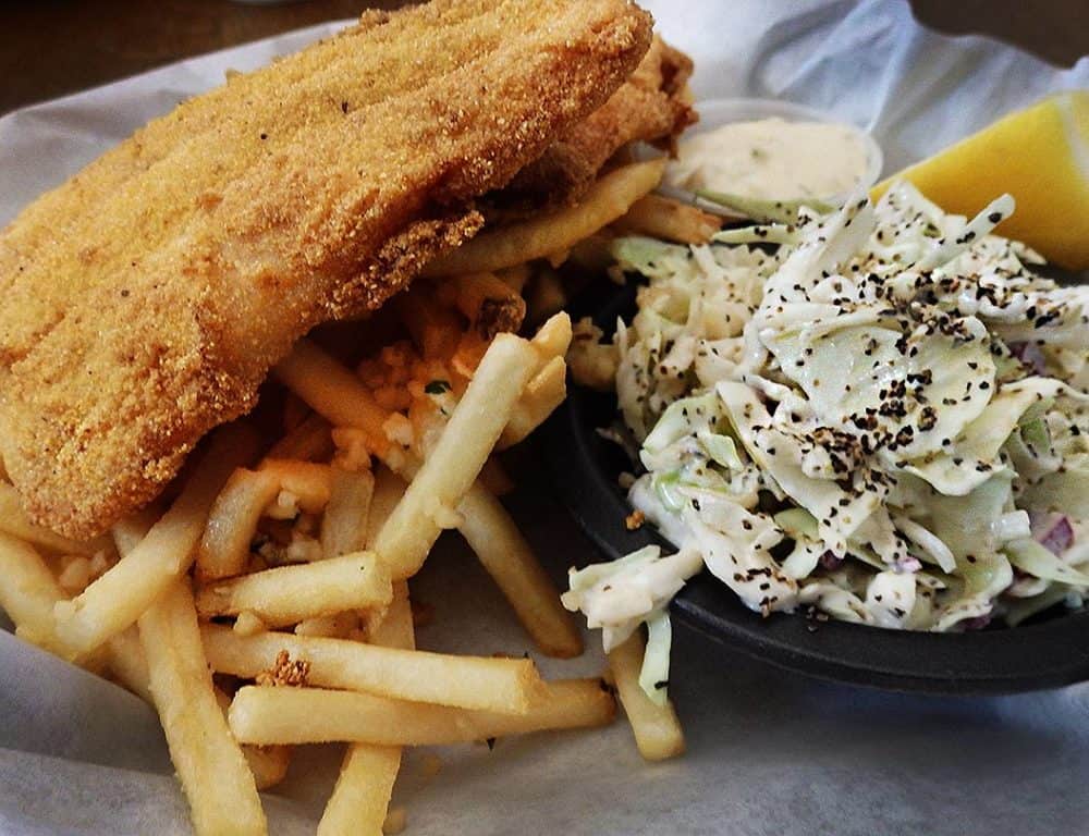 Cornmeal-crusted catfish and garlic fries with a side of coleslaw is a great take on fish and chips at The Prospector Cafe, Chloride, Arizona