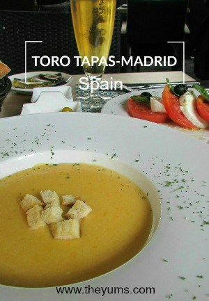 A bowl of creamy, butternut squash soup. Lunch at Toros Tapas Madrid, Spain