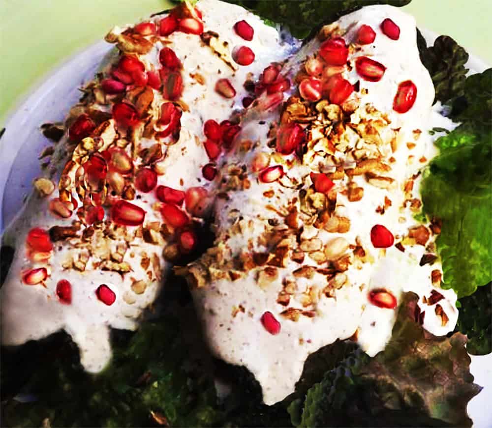 A plate of Chiles Nogada, the tri-color national dish that represents the red-white-&-green of the Mexican flag.