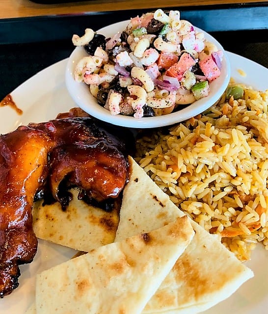 Rotisserie chicken, savory sides and pita wedges at Smokin Chikin in Clarksville, Tennessee