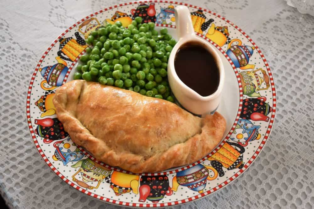 A Cornish pasty served with gravy and peas at Tina's Traditional Tea Room & Tavern