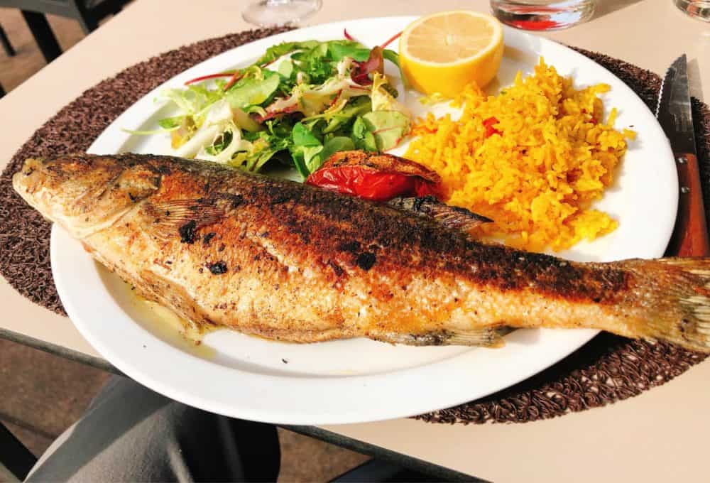 Delicious sea bass at an open air Dining at a sidewalk cafe in Marseille, France. Au Lamparo. #aulamparo #restaurant #foodie #france #marseille #fromtheyums