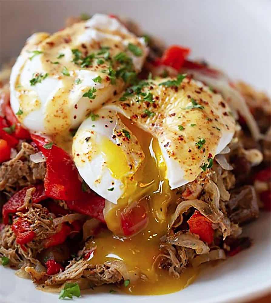 At Cafe Murrayhill, the pulled pork hash is studded with potatoes, roasted red peppers and onions and topped with a pair of perfectly poached eggs.